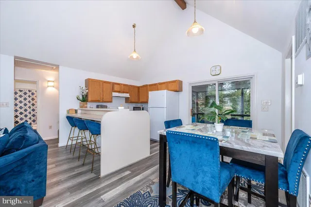 a view of kitchen with cabinets and wooden floor