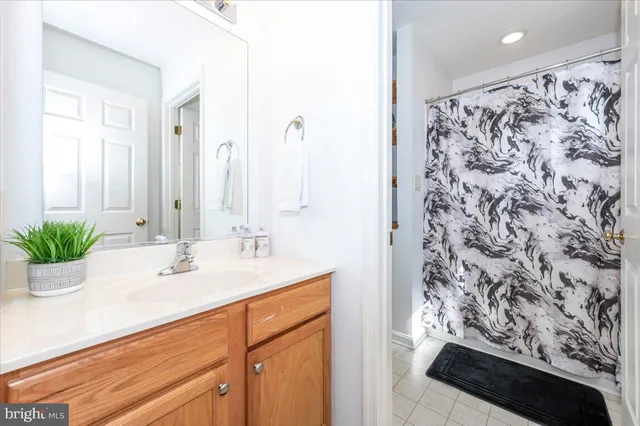 a bedroom with a bed and a wall painting