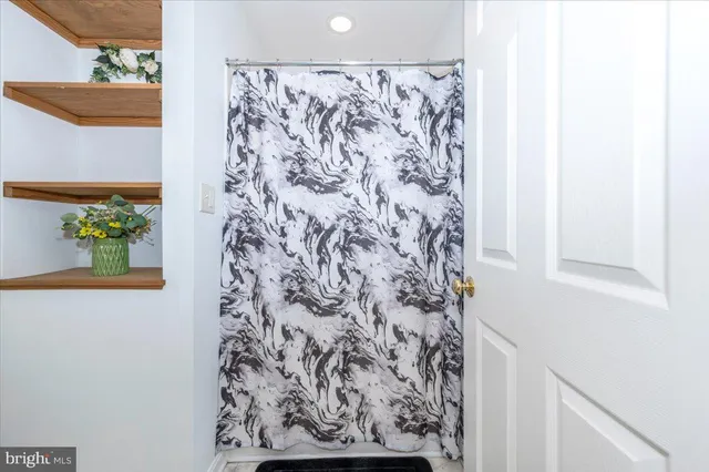 a bedroom with a bed and a fireplace