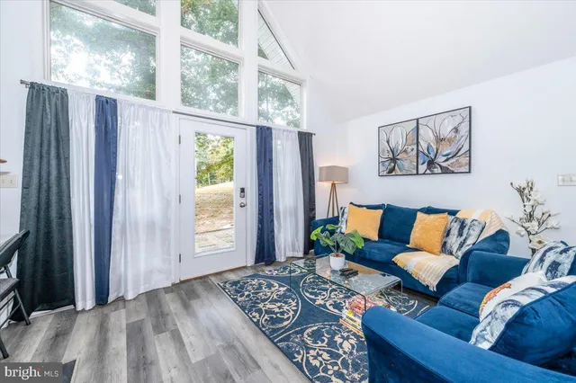 a living room with furniture fireplace and flat screen tv