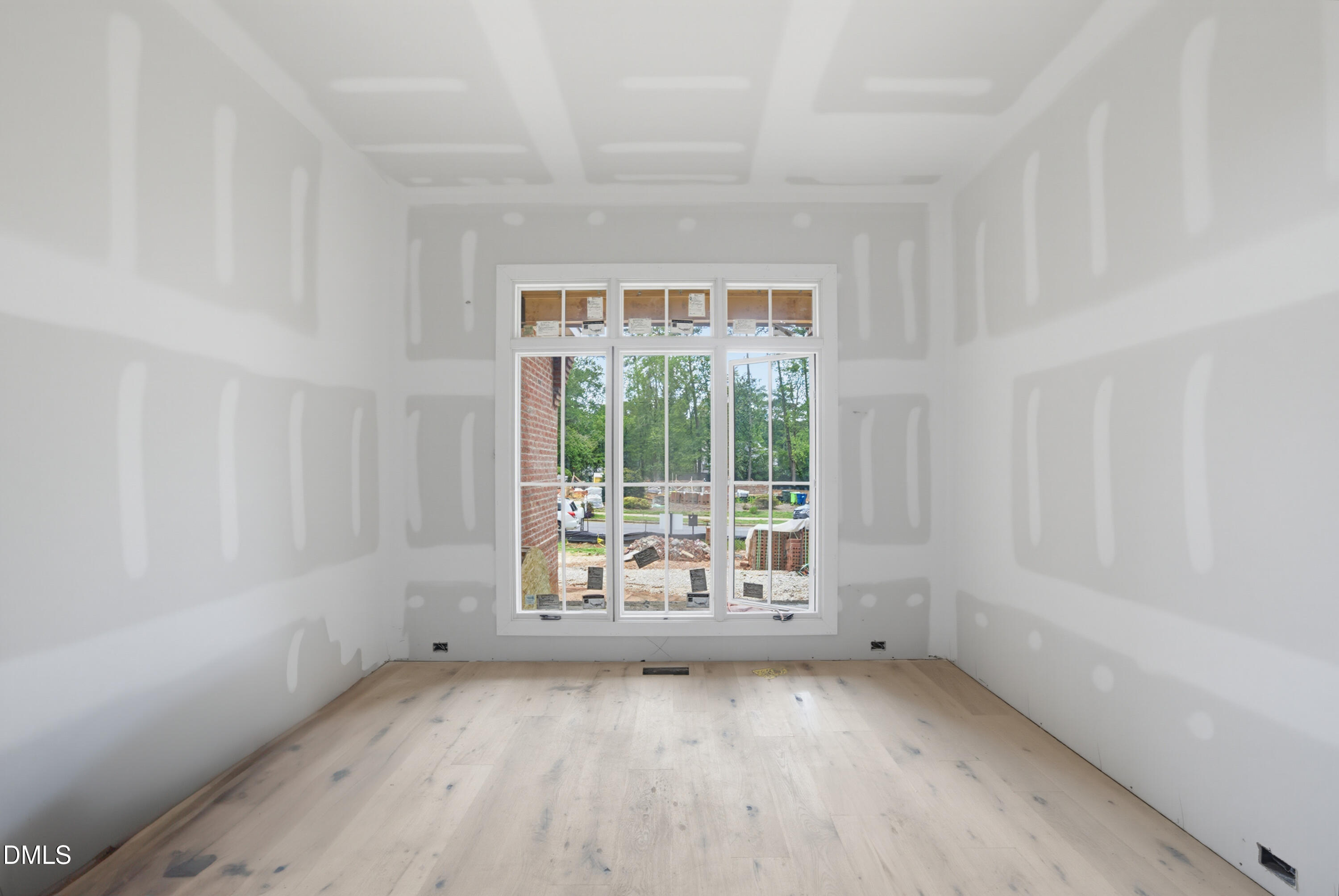 7508 Grist Mill Road Raleigh, NC 27615 - Photo 11 of 32 a view of an empty room with a window