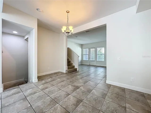 a view of staircase with white walls and stairs