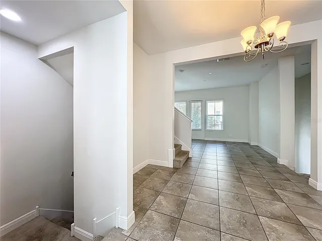 a view of an empty room and window