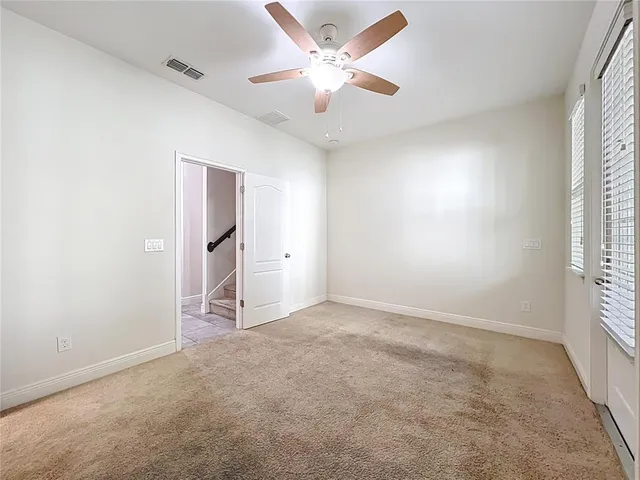 a spacious bathroom with a shower sink and mirror