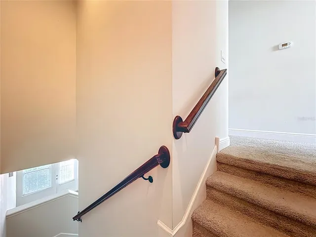 a bathroom with a sink a toilet a mirror a bathtub and shower