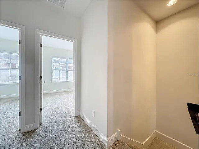 a view of a door and a window