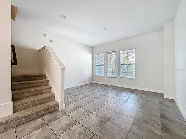 a view of a kitchen with an empty space and window