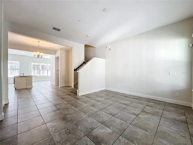 a stove top oven sitting inside of a kitchen
