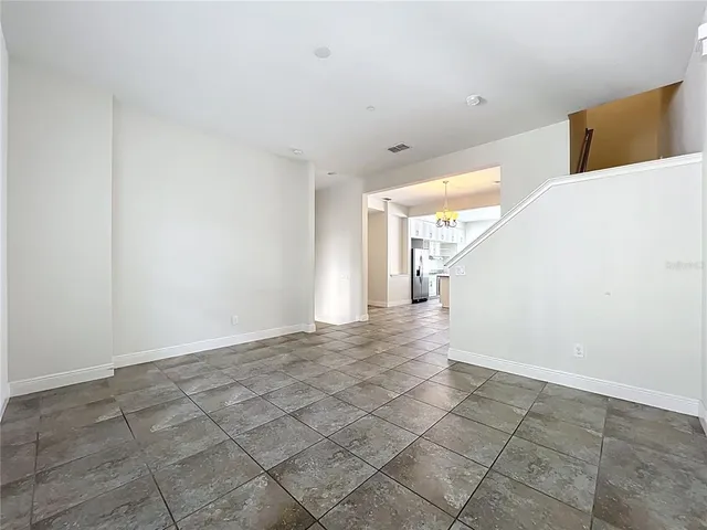 a kitchen with granite countertop a sink stainless steel appliances and cabinets