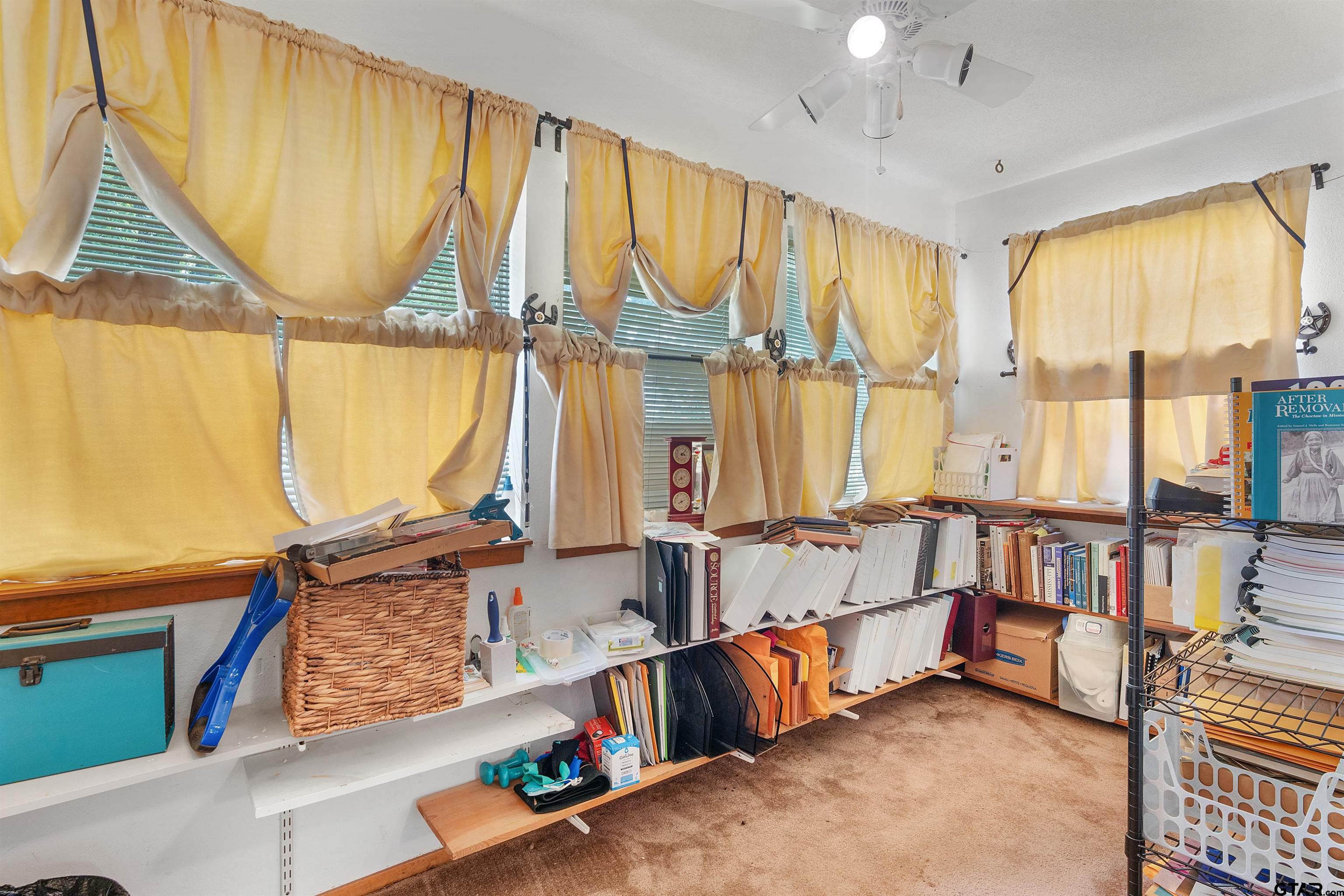 226 County Road 3533 Saltillo, TX 75478 - Photo 14 of 36 a living room with furniture and a large window