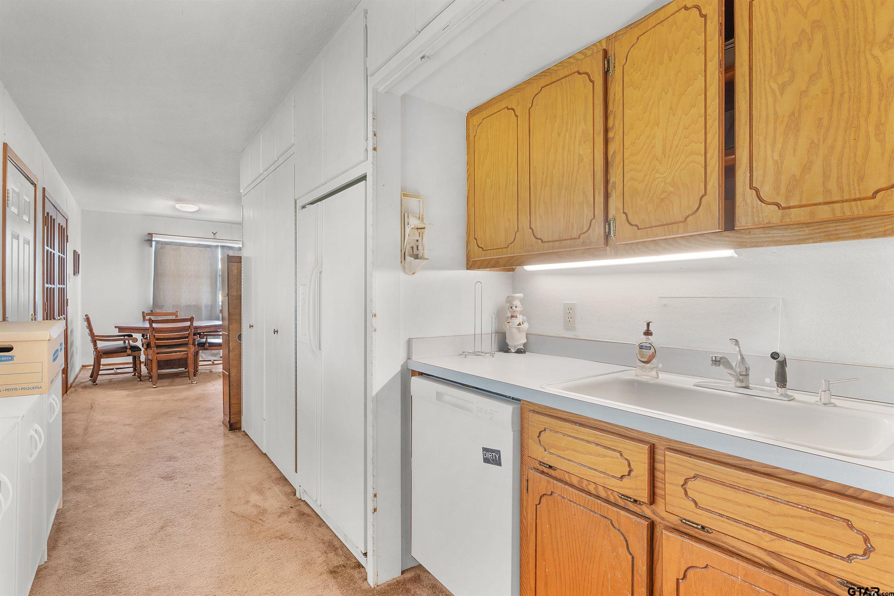 226 County Road 3533 Saltillo, TX 75478 - Photo 17 of 36 a kitchen with a sink and cabinets