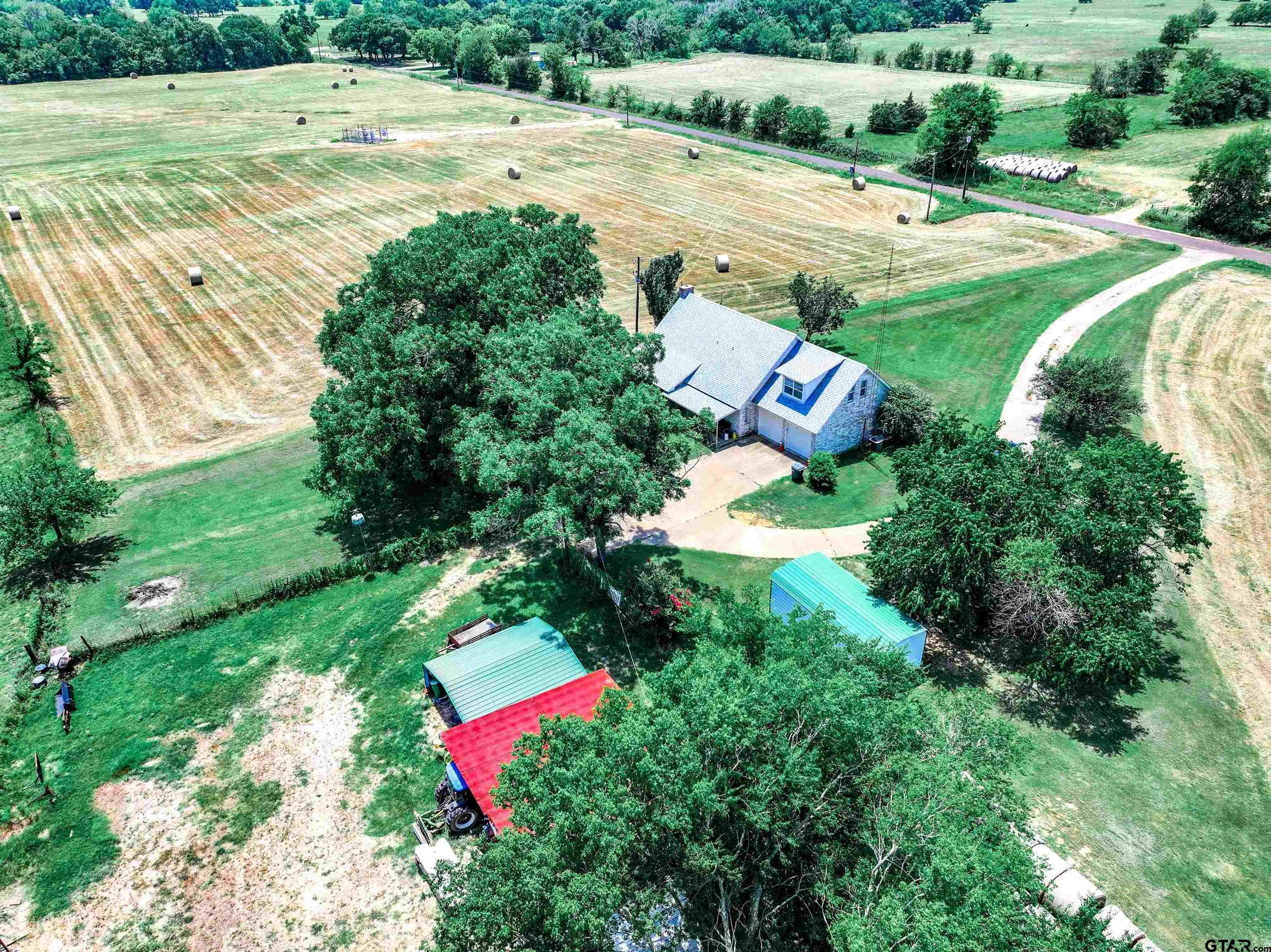 226 County Road 3533 Saltillo, TX 75478 - Photo 36 of 36 an aerial view of a house with a yard and lake view