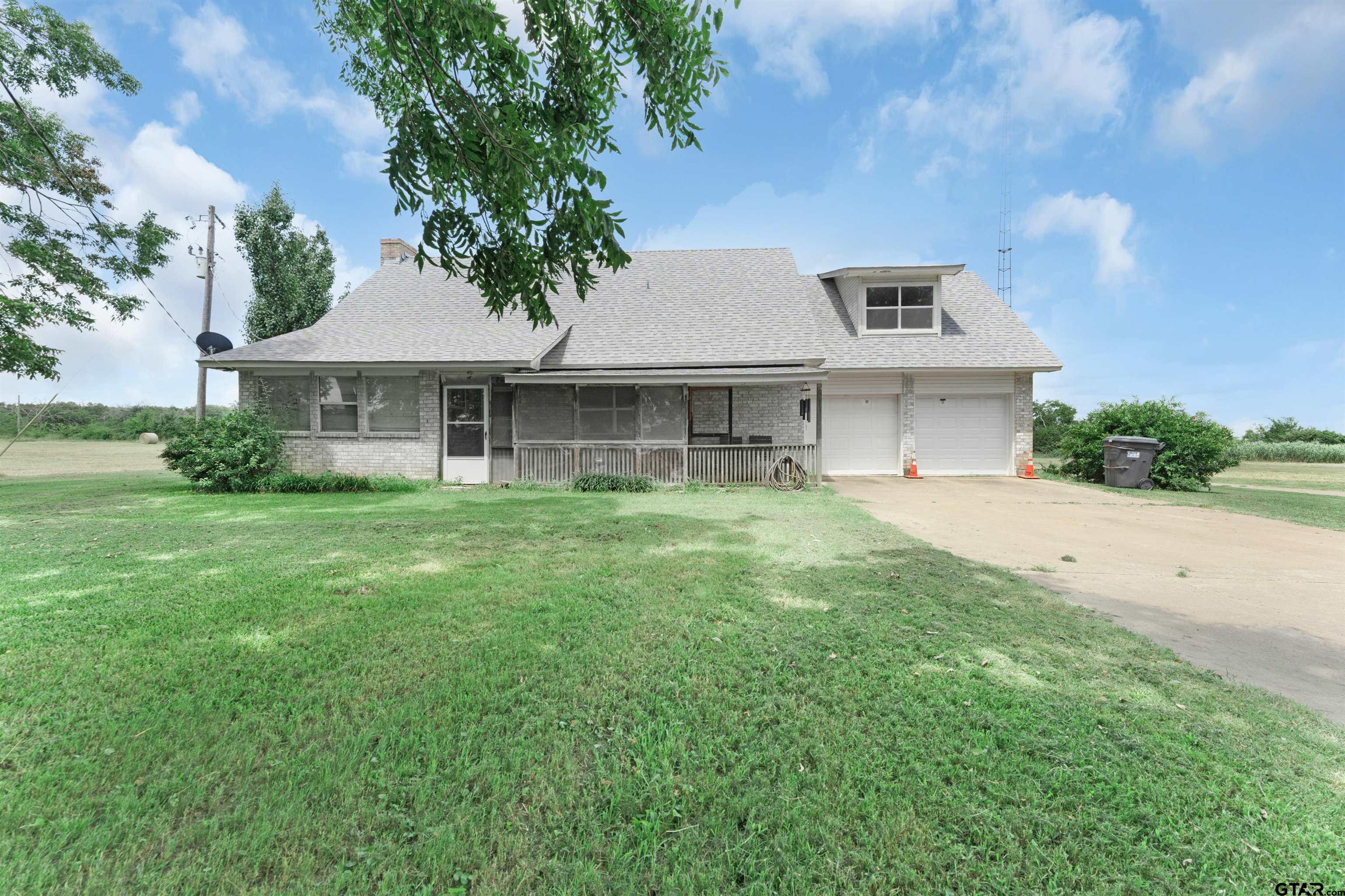 226 County Road 3533 Saltillo, TX 75478 - Photo 4 of 36 a front view of a house with a yard