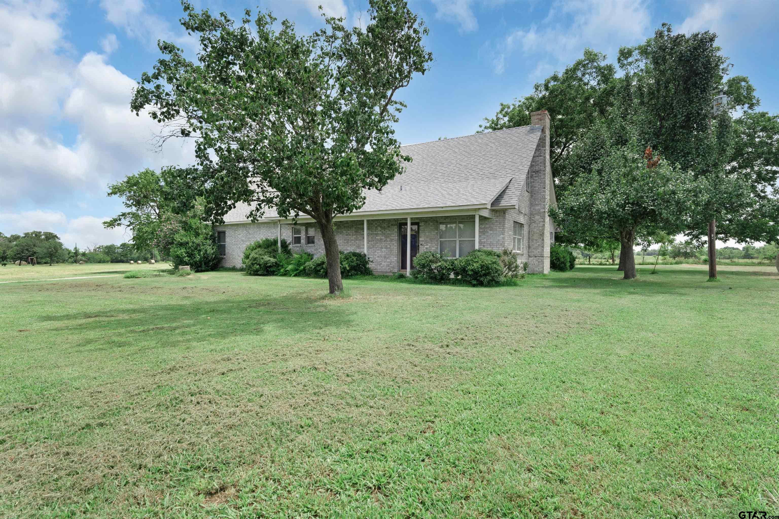 226 County Road 3533 Saltillo, TX 75478 - Photo 5 of 36 a front view of a house with a yard