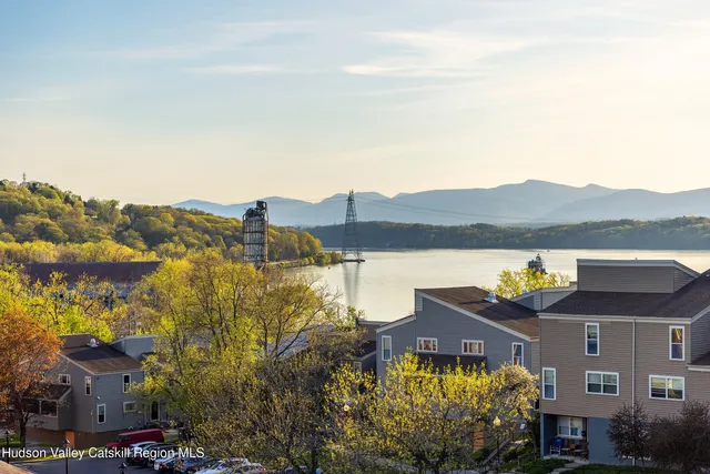 a view of a large building with a mountain in the background