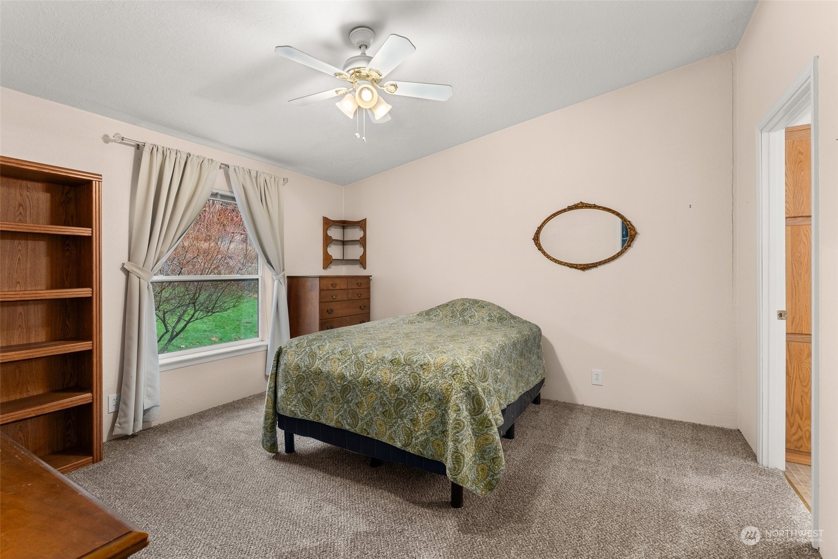 407 Conrad Road Winlock, WA 98596 - Photo 12 of 40 a bed sitting in a room next to a window