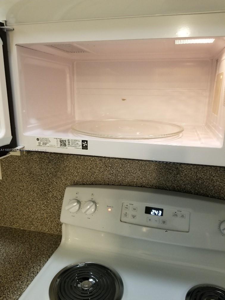 1663 Southeast 27th Drive, Unit 202 Homestead, FL 33035 - Photo 12 of 16 a utility room with dryer and washer