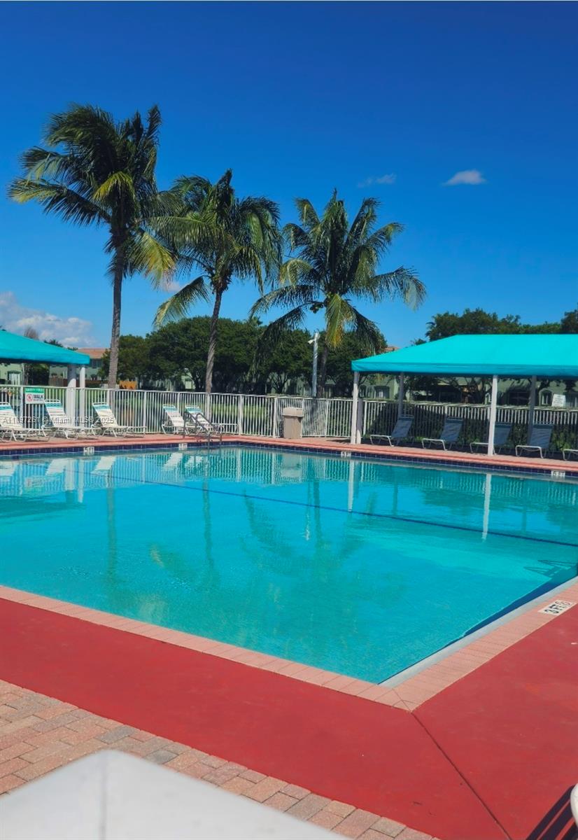 1663 Southeast 27th Drive, Unit 202 Homestead, FL 33035 - Photo 3 of 16 a view of a golf course with a house