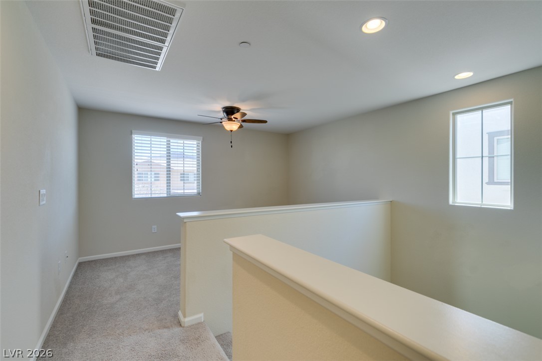 2549 Sable Ridge Street Henderson, NV 89044 - Photo 34 of 48 A well-lit loft area provides flexible space, ideal for various uses.