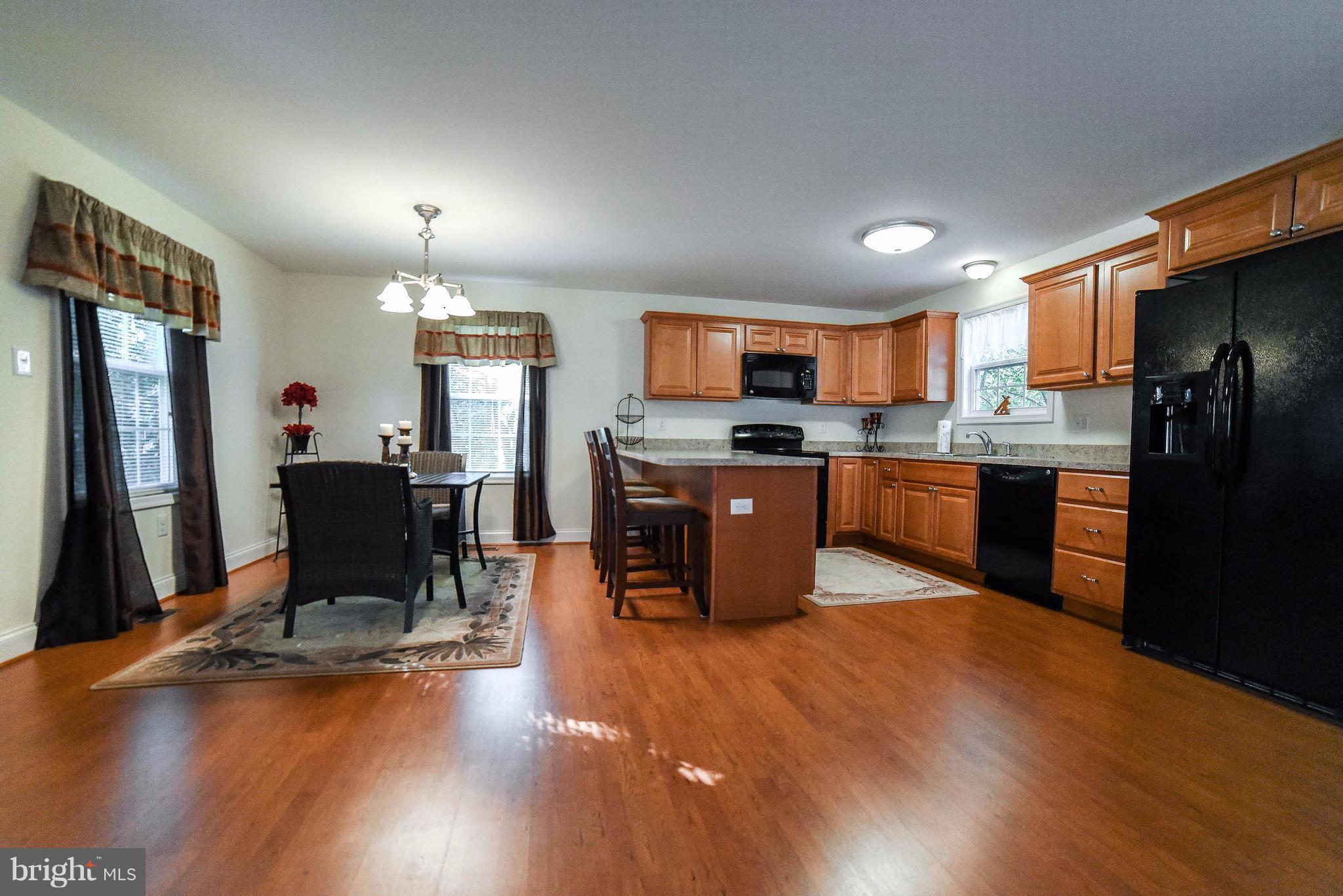 17877 2nd Street Tall Timbers, MD 20690 - Photo 4 of 29 Easy-care laminate flooring looks great