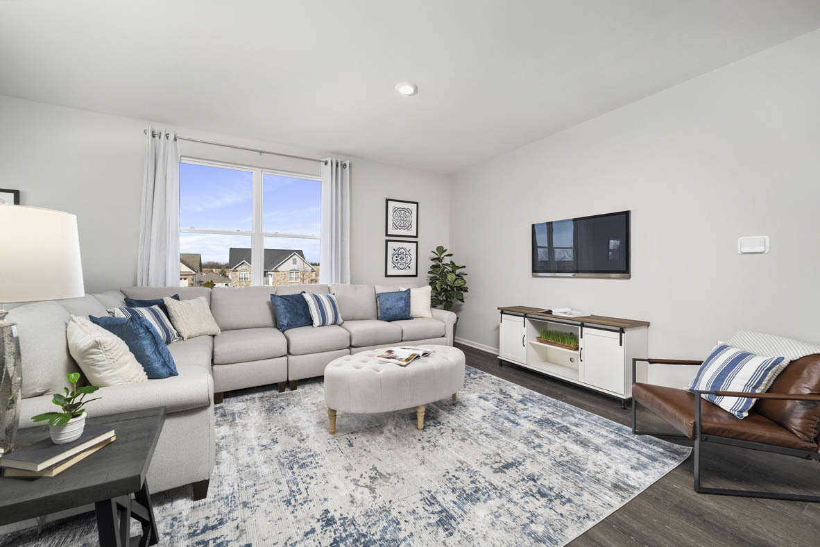 920 Eineke Boulevard Algonquin, IL 60102 - Photo 11 of 27 a living room with furniture and a flat screen tv