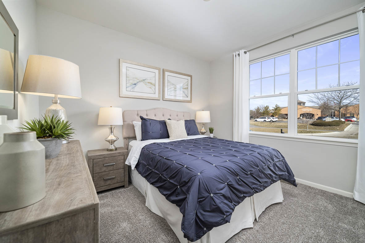 920 Eineke Boulevard Algonquin, IL 60102 - Photo 18 of 27 a bedroom with a bed and window