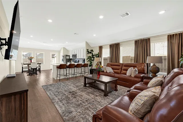 a living room with furniture and a table