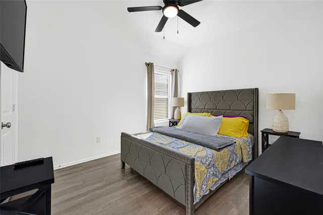 a bedroom with a bed and window