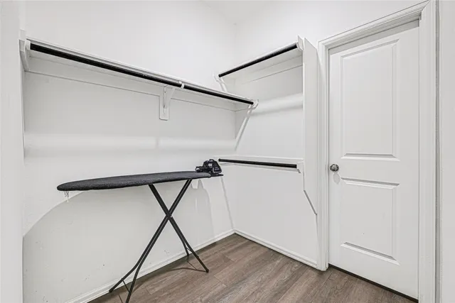 a kitchen with a refrigerator and a stove