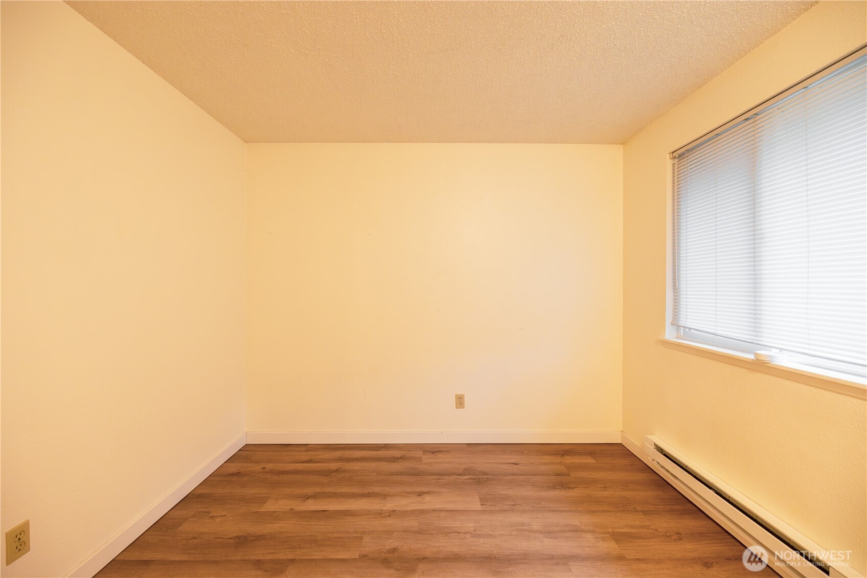 1534 Franklin Street Bellingham, WA 98225 - Photo 6 of 6 a view of a room with wooden floor and a window