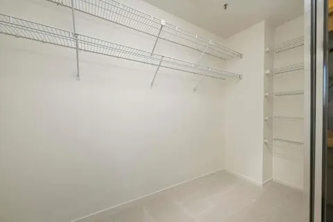 a view of a room with racks on the wall
