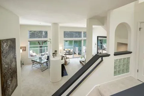 a very nice looking living room with a large window