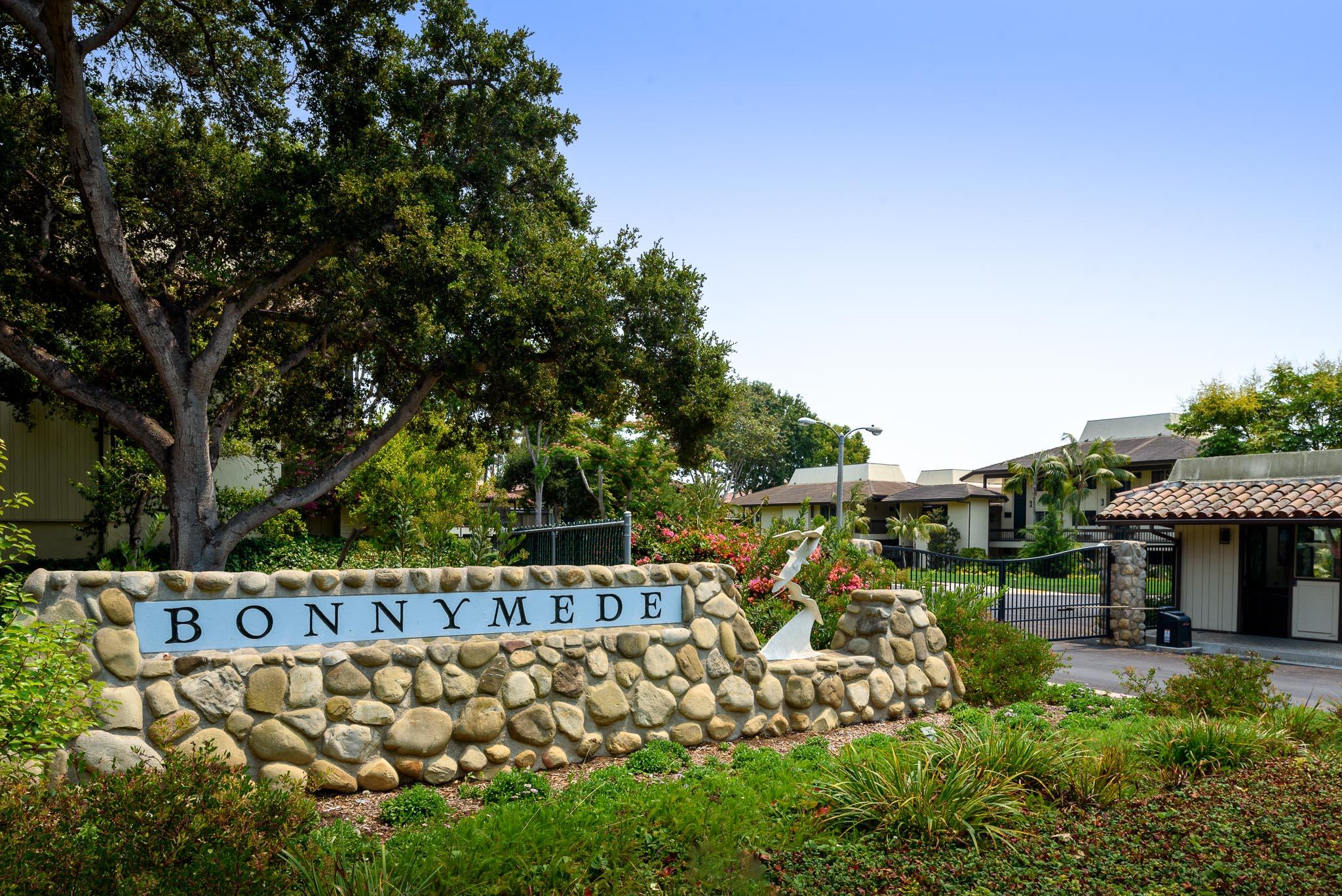a view of a wooden house with a yard