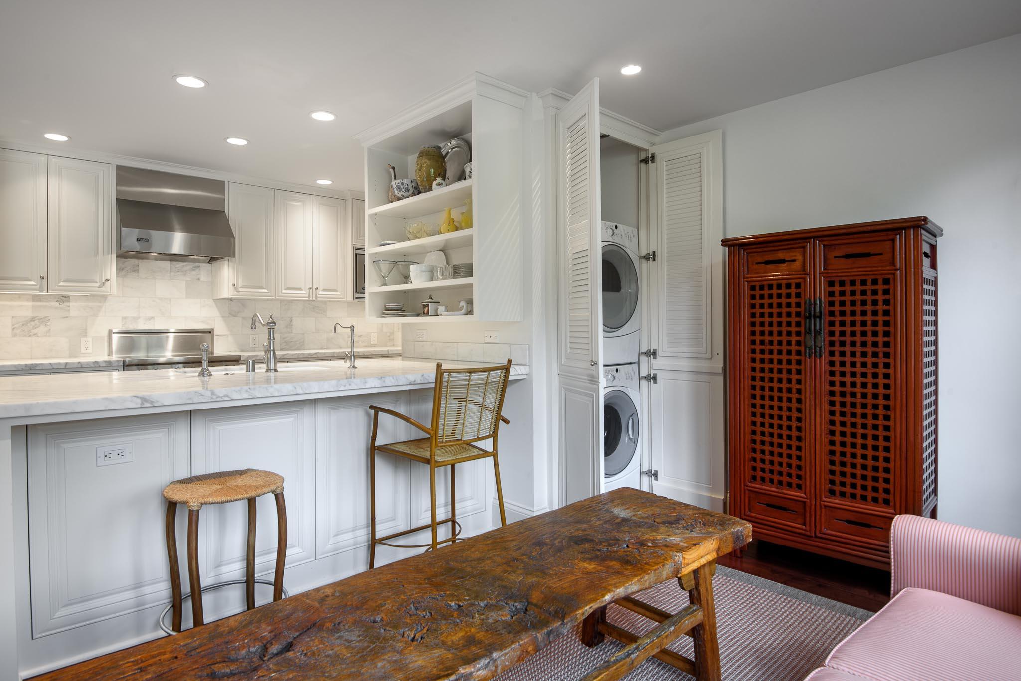 1300 Plaza Pacifica Montecito Ca Montecito, CA 93108 - Photo 12 of 31 a kitchen with a table chairs refrigerator and microwave