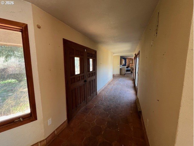 13707 Northwest Bishop Road Hillsboro, OR 97124 - Photo 27 of 45 a view of a hallway with wooden floor and a livingroom