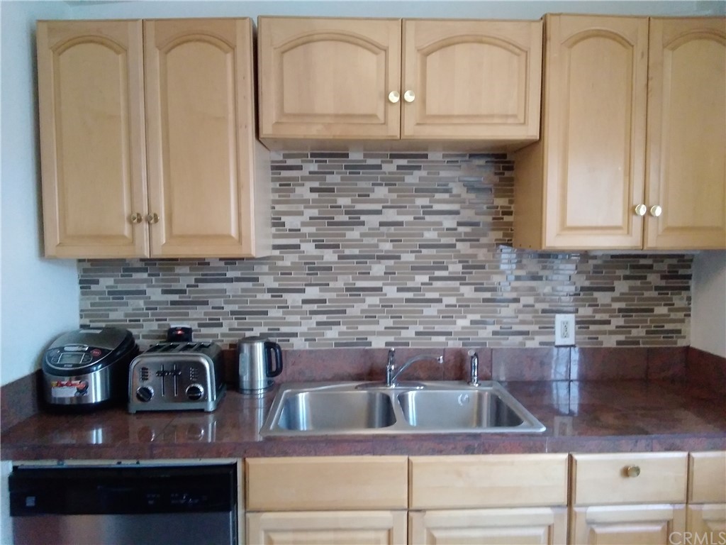 12101 Hermosura Street Norwalk, CA 90650 - Photo 12 of 20 a kitchen with a sink and cabinets