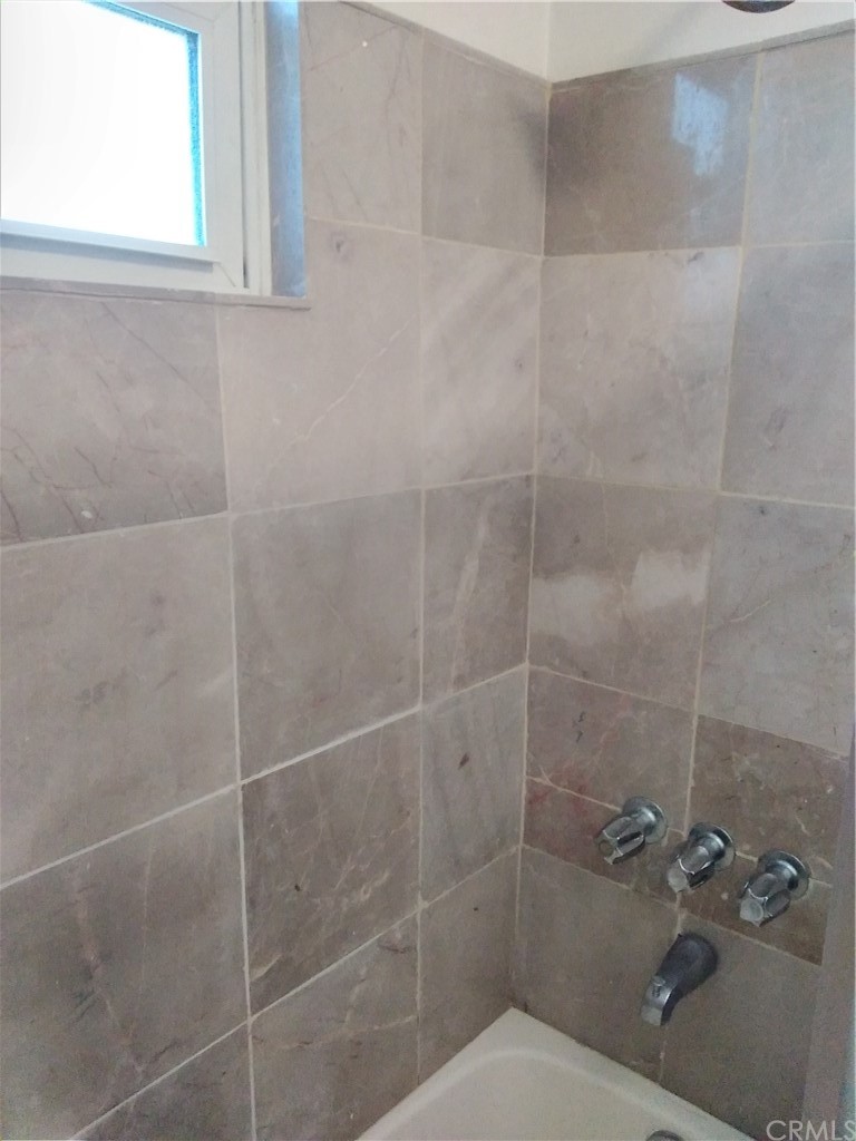 12101 Hermosura Street Norwalk, CA 90650 - Photo 16 of 20 a bathroom with a shower