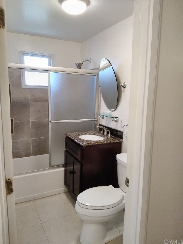 12101 Hermosura Street Norwalk, CA 90650 - Photo 17 of 20 a bathroom with a sink toilet and shower