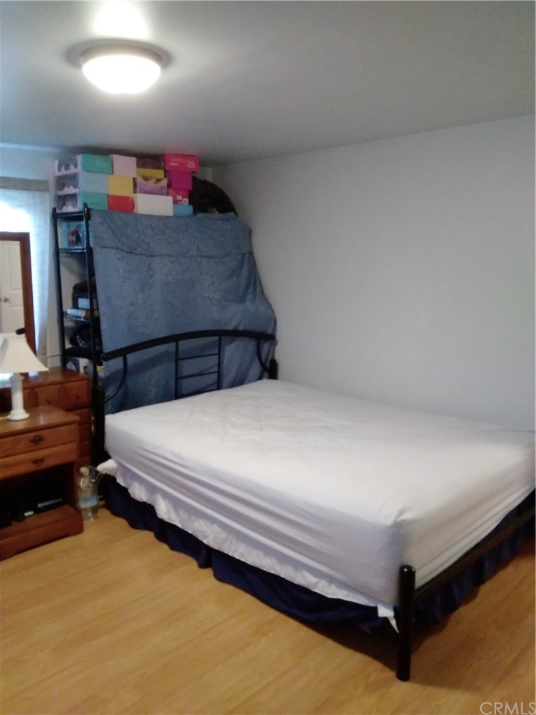 12101 Hermosura Street Norwalk, CA 90650 - Photo 19 of 20 a bedroom with a bed and dresser