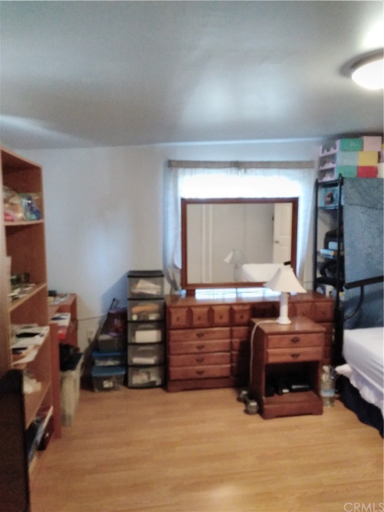 12101 Hermosura Street Norwalk, CA 90650 - Photo 20 of 20 a living room with furniture and a flat screen tv