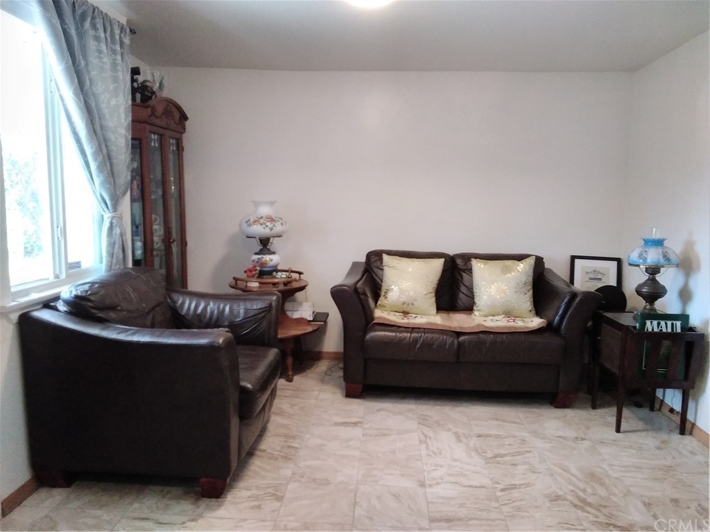 12101 Hermosura Street Norwalk, CA 90650 - Photo 8 of 20 a living room with furniture and a couch
