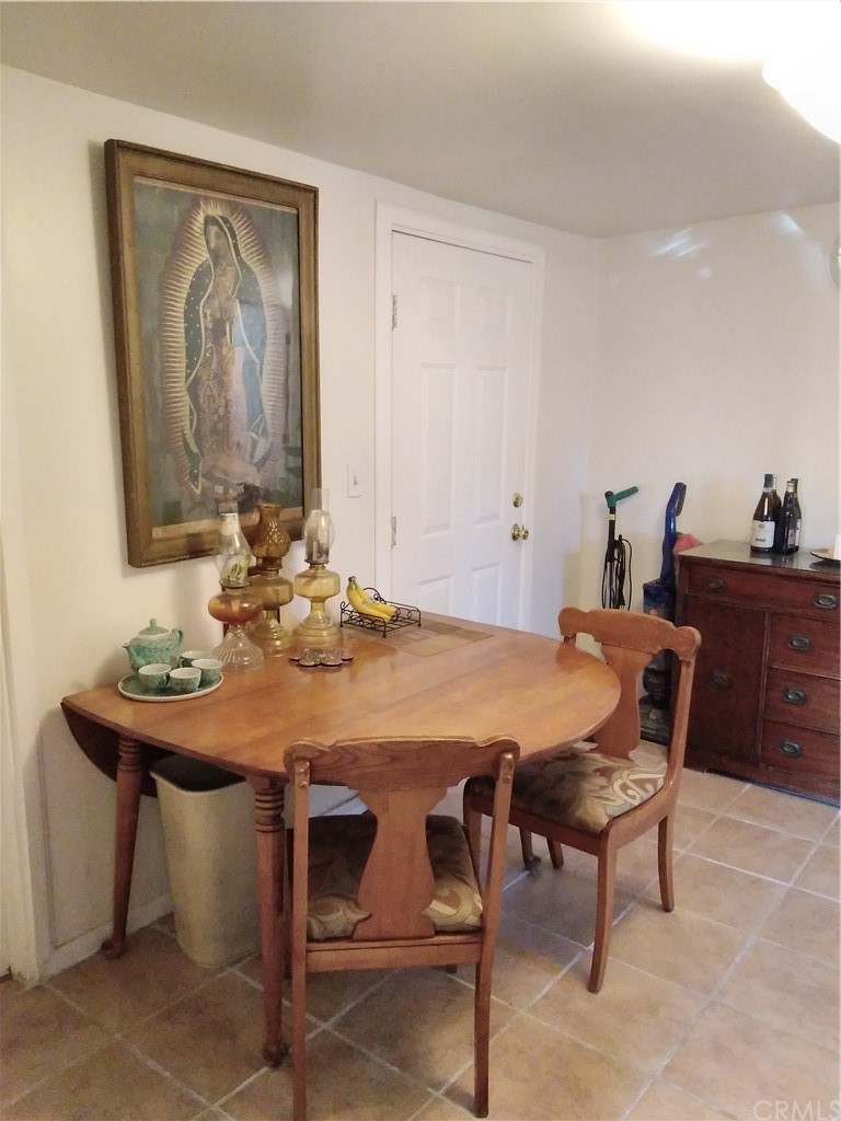 12101 Hermosura Street Norwalk, CA 90650 - Photo 9 of 20 a dining room with furniture and wooden floor