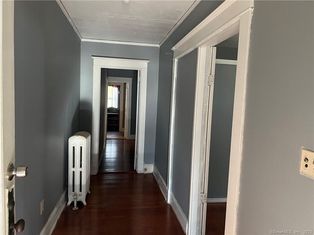 796 Tower Avenue Hartford, CT 06112 - Photo 3 of 9 a view of a hallway with wooden floor and a hallway