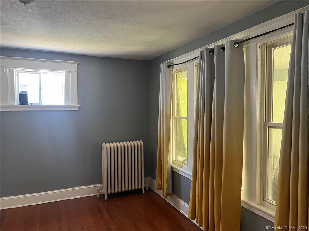 796 Tower Avenue Hartford, CT 06112 - Photo 4 of 9 a view of a room with wooden floor and windows