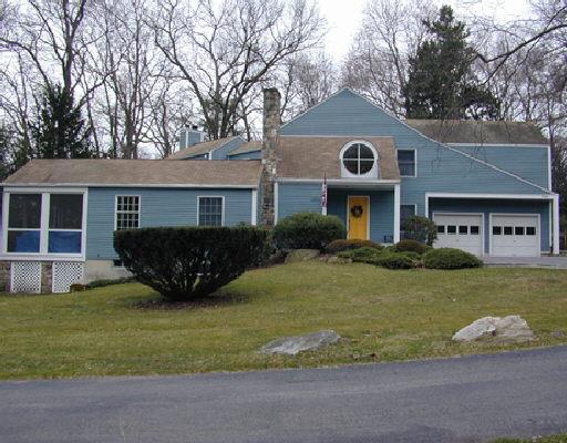 733 Rock Rimmon Road Stamford, CT 06903 - Photo 1 of 1 a front view of a house with a garden and yard
