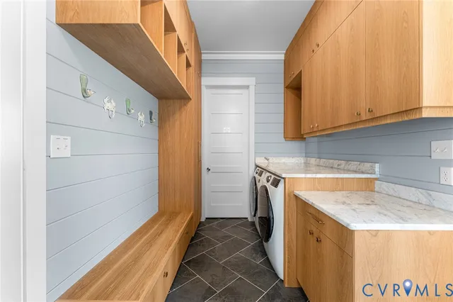 a utility room with a sink a washer and dryer