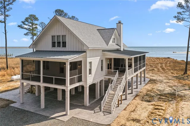 a front view of a house with wooden deck