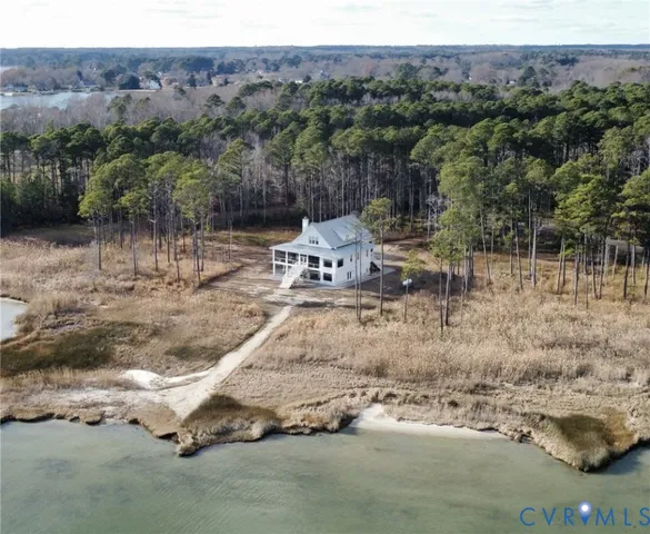 a view of a wooden house with a yard