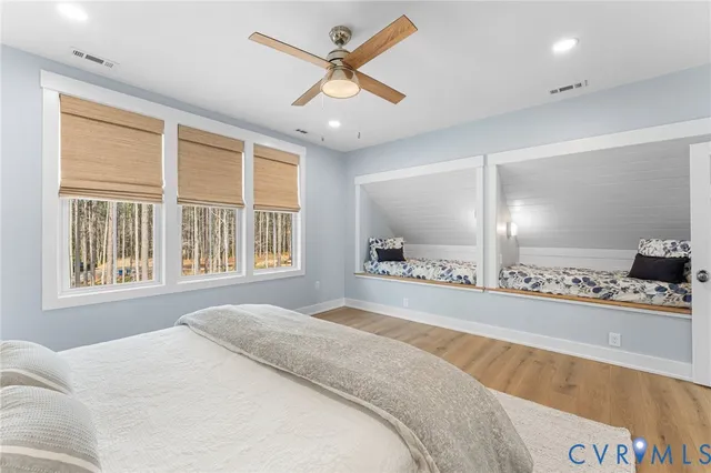 a bedroom with a large bed and a large window