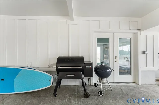 a room with furniture and a potted plant